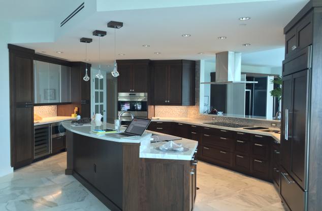 Custom Walnut kitchen with Island and integrated appliances.  Contemporary Walnut stain.