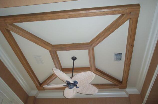 Applied molding ceiling in stained wood