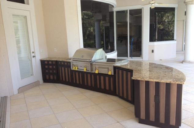 Out door kitchen finished in 2 color stripe vertical stain in cypress